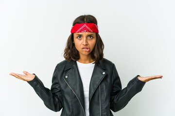 Young latin rocker woman isolated on white background