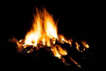 Fire flames on black background. fire burst texture for banner backdrop.