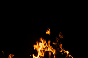 Fototapeta premium Fire flames on black background. fire burst texture for banner backdrop.