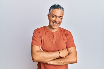 Handsome middle age mature man wearing casual clothes happy face smiling with crossed arms looking...