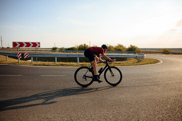 Active man in helmet racing on outdoors