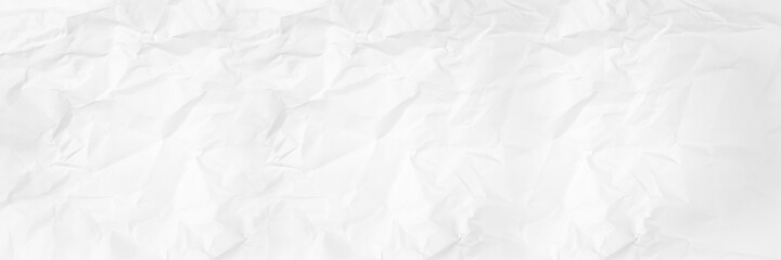 white and gray crumpled paper texture background. crush paper so that it becomes creased and wrinkled.