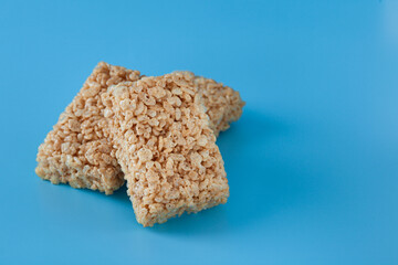 three cereal bars on blue and clean surface