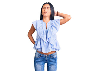 Young beautiful latin girl wearing casual clothes suffering of neck ache injury, touching neck with hand, muscular pain