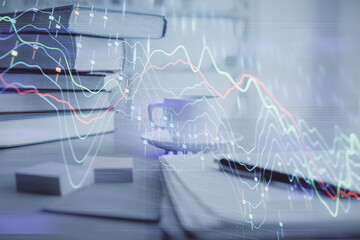Double exposure of financial chart drawing and desktop with coffee and items on table background. Concept of forex market trading