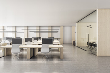 Bright coworking office interior with equipment and daylight.