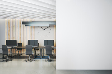 Luxury coworking office interior with blank wall  and large clock.