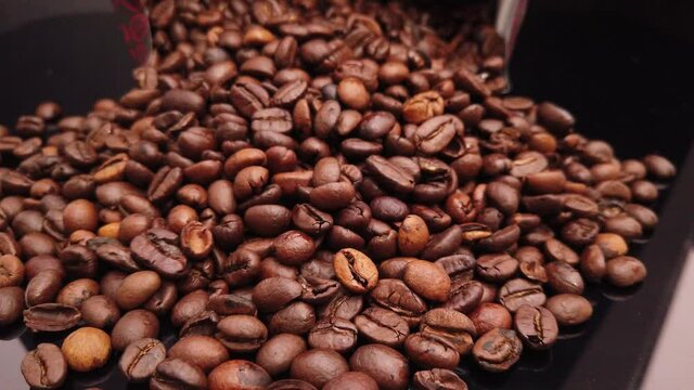 Coffee beans freshly roasted in close up - food photography