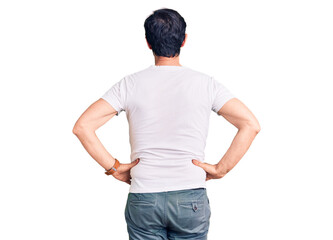 Obraz premium Middle age handsome man wearing casual t-shirt standing backwards looking away with arms on body