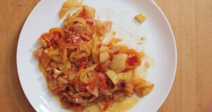 Eating lecho (letsho, lecso), food made mainly of peppers, tomatos and onions