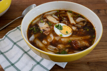 Kuay Jab Nam Kon, Thick Rolled Thai Noodles in Brown Pork Soup with Pork Belly 