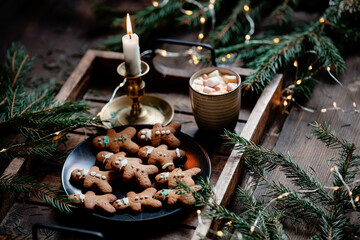 Christmas gingerbread cookies and mug of coffee on a tray
