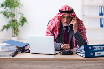 Male arab bookkeeper extremely tired with an excessive work