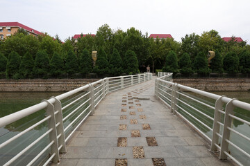 Fototapeta na wymiar Bridge metal railings in the park