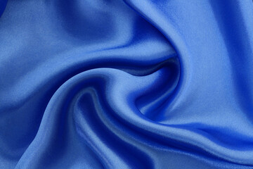 Blue fabric texture background, detail of silk or linen pattern.