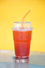 Iced tea drinks on the table with a yellow background
