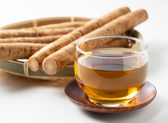 Burdock tea on a white background
