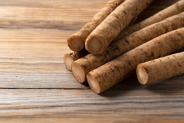 A burdock on a wooden board background