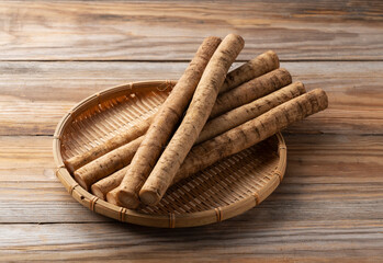 A burdock on a wooden board background