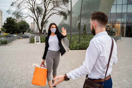 Young Woman Stopping Man To Approaching Her Without A Facemask, Coronavirus Times