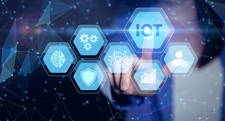 Internet of things - IOT concept. Businessman offer IOT products and solutions. Young businessman  select the abstract chip with text IoT on the virtual display.