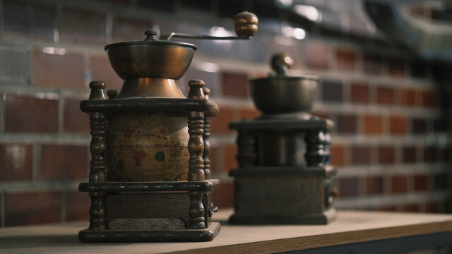antique coffee grinders with beautiful globe design