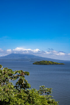 View of Small Islands in the Middle of the Lake Leading to Mombacho Volcano Covered in Clouds from Zapatera Island outside of Granada, Nicaragua