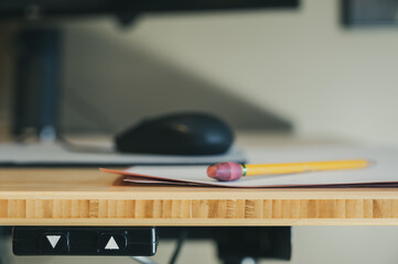 Focus on control buttons for a motorized sit-stand office desk