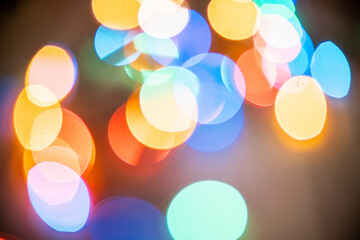 Blurred background. Bright christmas background. Plenty of sparkling bokeh from defocused garland lights. Defocused image.