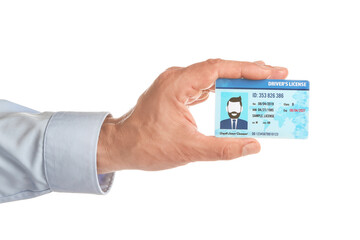 Male hand with driving license on white background