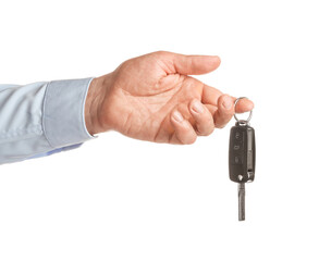 Male hand with car key on white background
