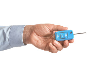 Male hand with car key on white background