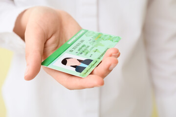 Woman with driving license, closeup