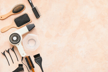 Set of hairdresser tools on color background