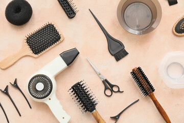 Set of hairdresser tools on color background