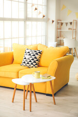 Interior of living room with sofa and table