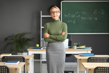 Mature female teacher in classroom