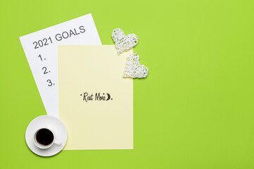 To do list on 2021 year with cup of coffee on color background
