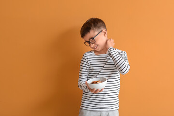 Little boy with food allergy on color background