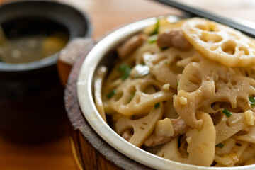 angle view fast food of fried pork with slices of lotus root with bowl of soup horizontal composition