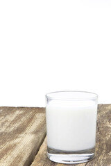 A glass of milk on a wooden background. Copy sapce. Place for text