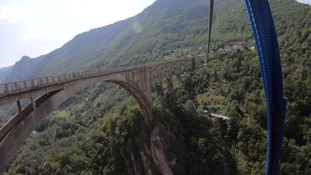 Shot of Durdevica bridge over Tara river zipline ride at , Montenegro