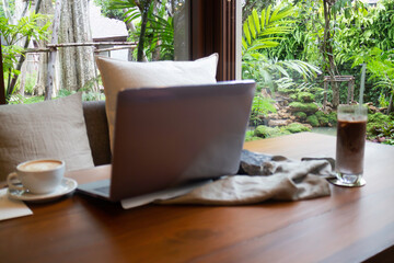 Hot coffee and iced coffee on wooden table