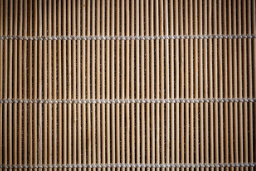 Background of bamboo sticks tied with thread. Empty surface for advertising or menus of Japanese and Chinese cuisine.