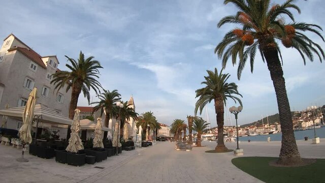 Walking through the beautiful promenade of Trogir town, Croatia