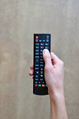 tv remote control in hand