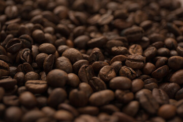 Roasted coffee beans close up blur background