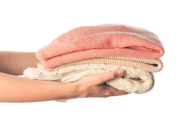 Female hands with warm clothes on white background