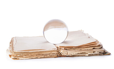 Crystal ball of fortune teller and spell book on white background
