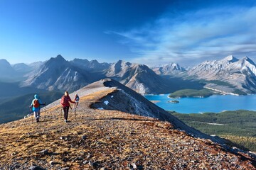 Women hikers walking on beautiful ridge with lake view in Canadian Rockies. Alberta. Canada 